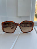 Oversized turtle shell sunglasses